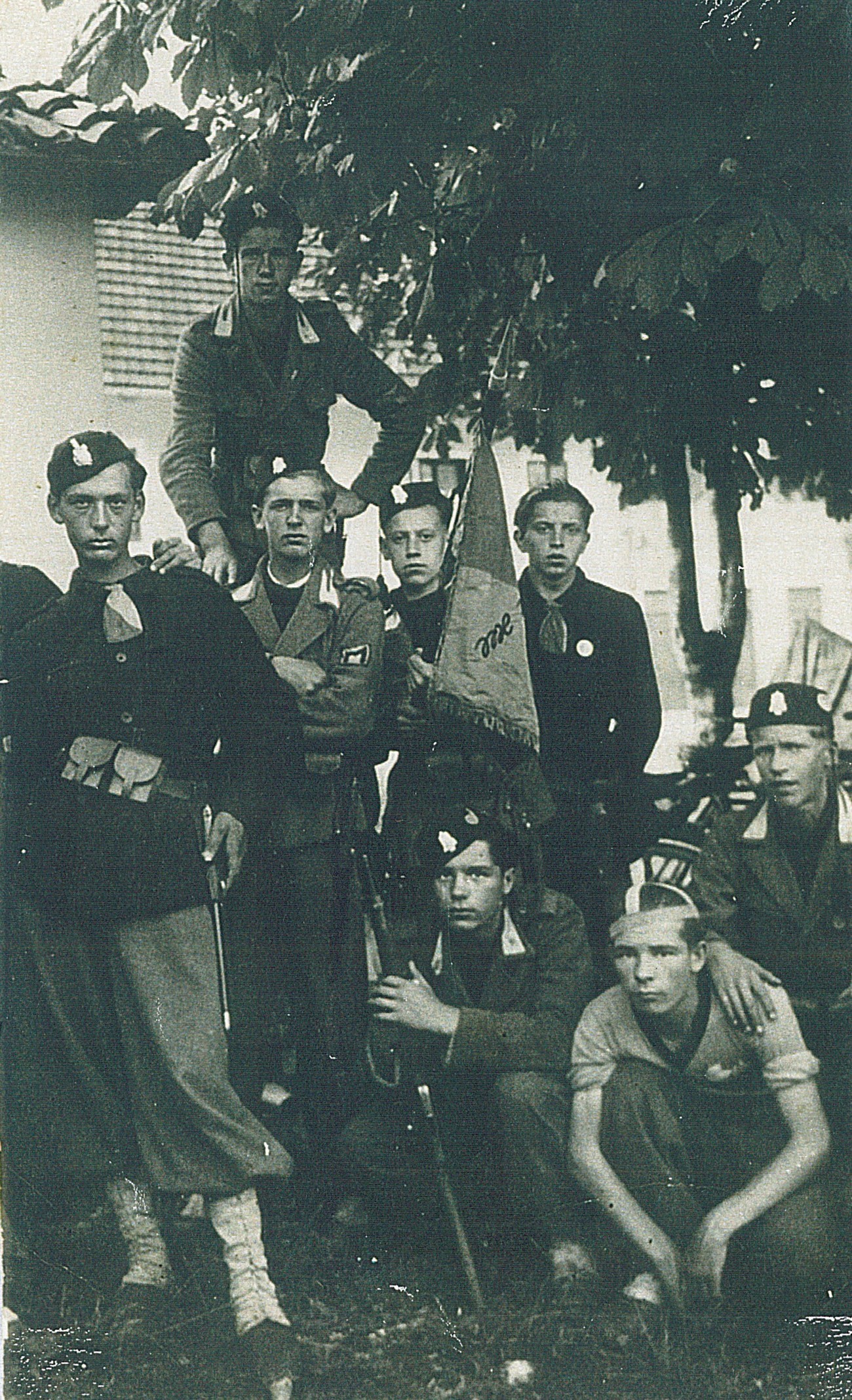 The Fascist regime placed great emphasis on the upbringing of youth in the spirit of militarism. In the photograph, we can see a group of young from Idrija, who were members of the Fascist youth organisation. Private archive of Slavko Moravec, Idrija War Museum.