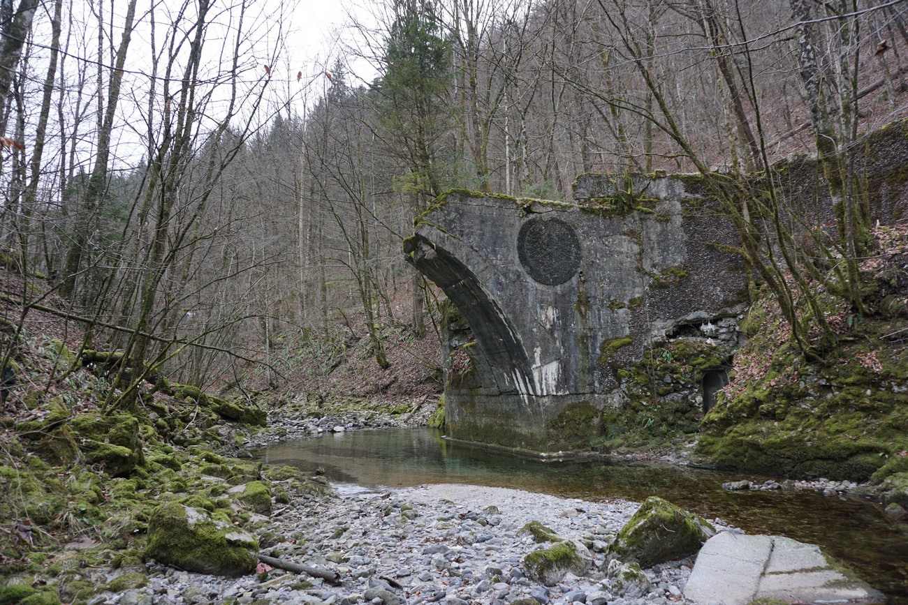 The ruins of the bridge in Podroteja near Idrija, mined by miners from Idrija on 19 September 1943 on the orders of the Partisans, are still visible today. By mining roads and bridges, placing barriers, and by actively defending the outskirts, they managed to repel some German attempts to enter the town. Author: Matevž Šlabnik.