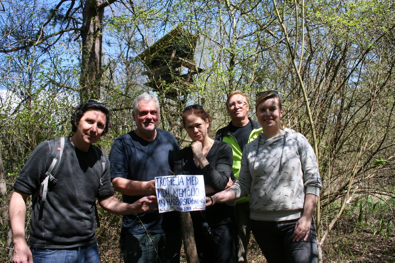On April 13, 2018, on the overgrown right, Croatian bank of the Drava River, south of Središče ob Dravi, part of the research team (from left: Peter Mikša, Božidar Flajšman, Darja Kerec, Božo Repe, and Kornelija Ajlec) marked the tri-border point between Germany, Hungary, and NDH. Today, hardly any physical remains of the former state border can be found in the flooded, muddy, and overgrown area. (Team members Matija Zorn and Peter Mikša found a possible border moat south of the village of Virje. Author: Božidar Flajšman.